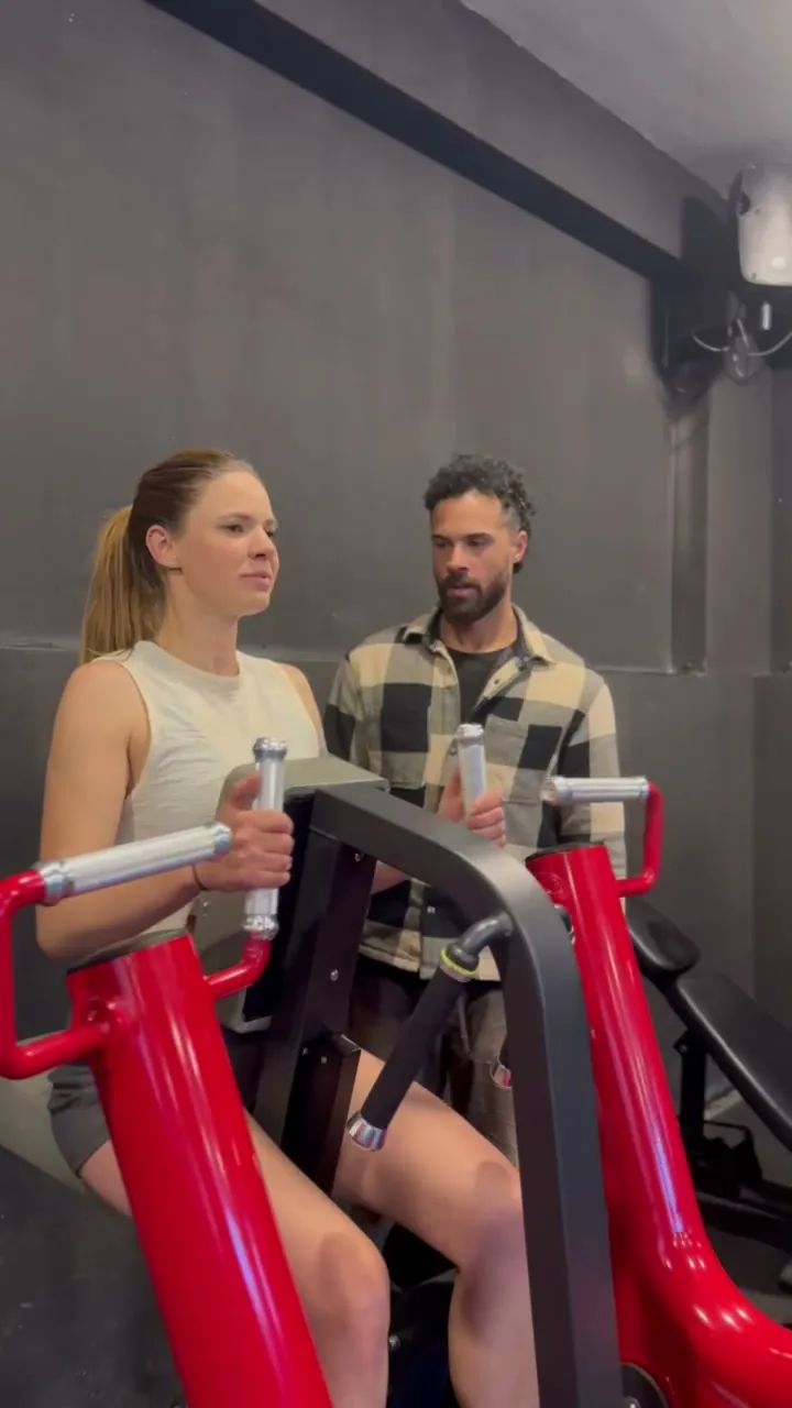 Jono Mitchell coaching a client through exercise technique