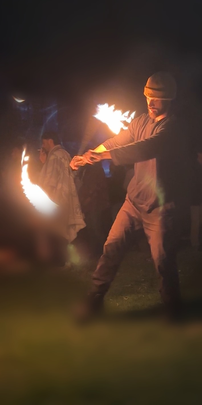 Fire poi performance at a live nighttime event