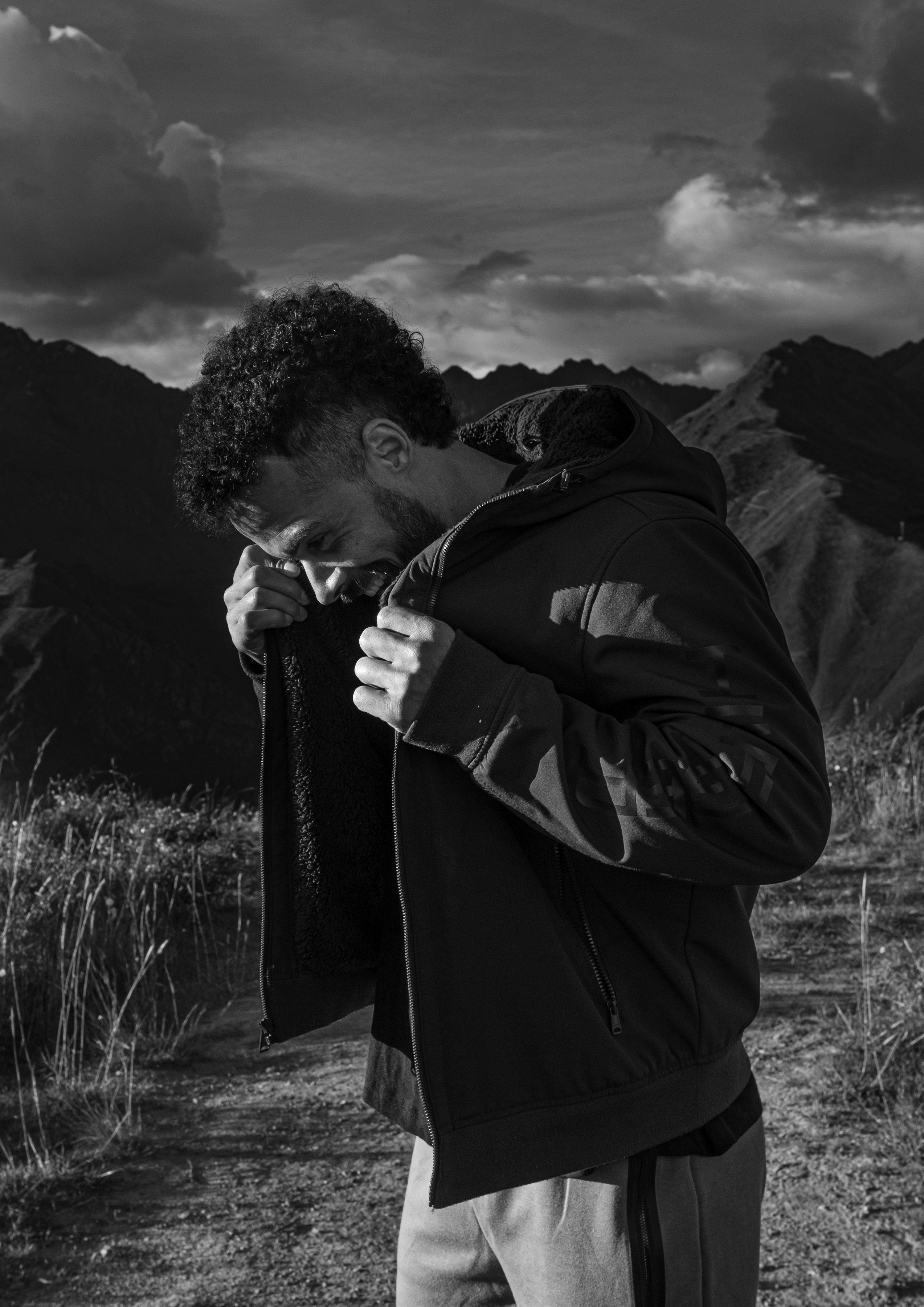Black and white laughing mountain portrait of Jono Mitchell
