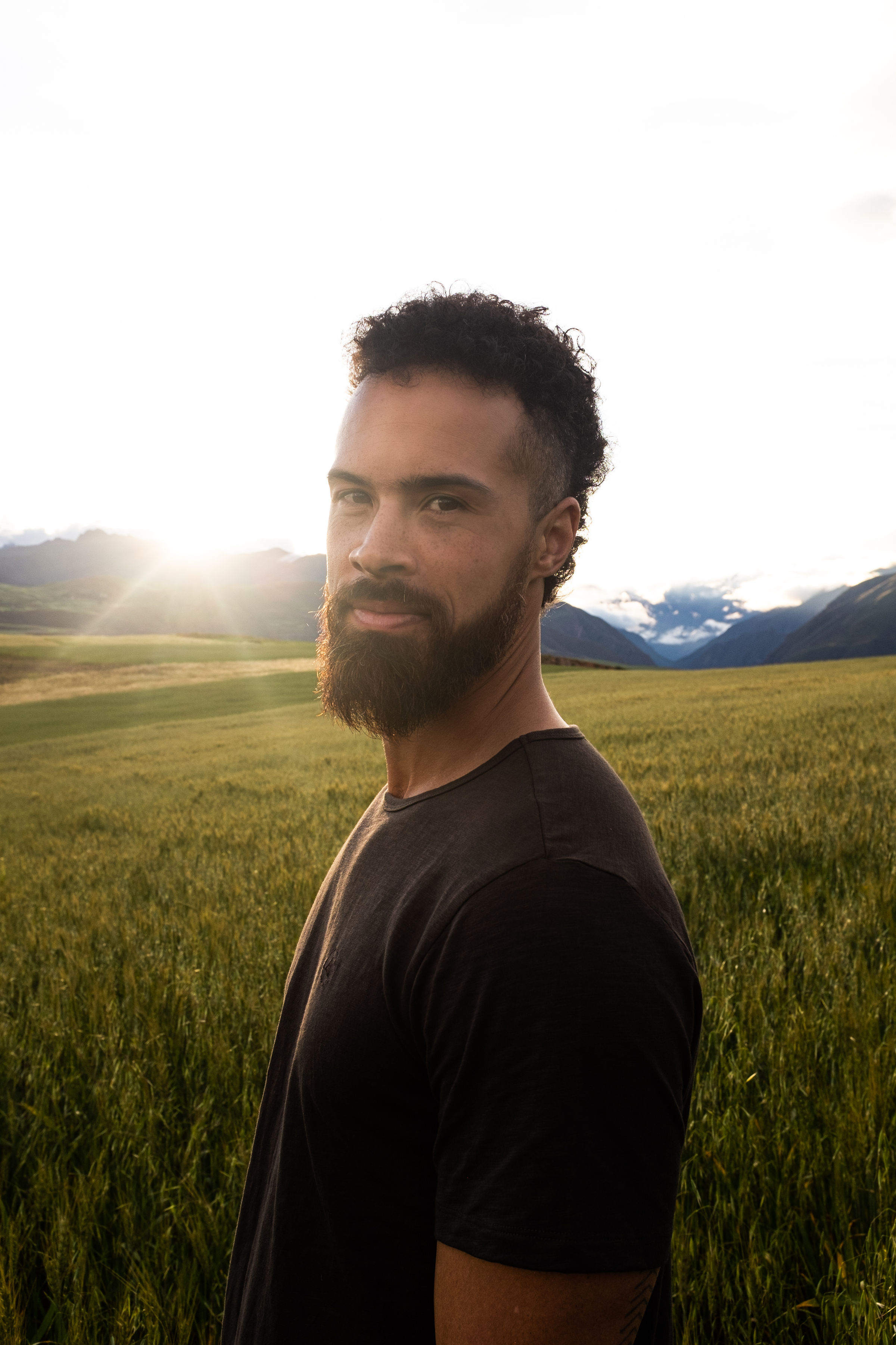 Jono Mitchell in a warm wheat-field editorial portrait