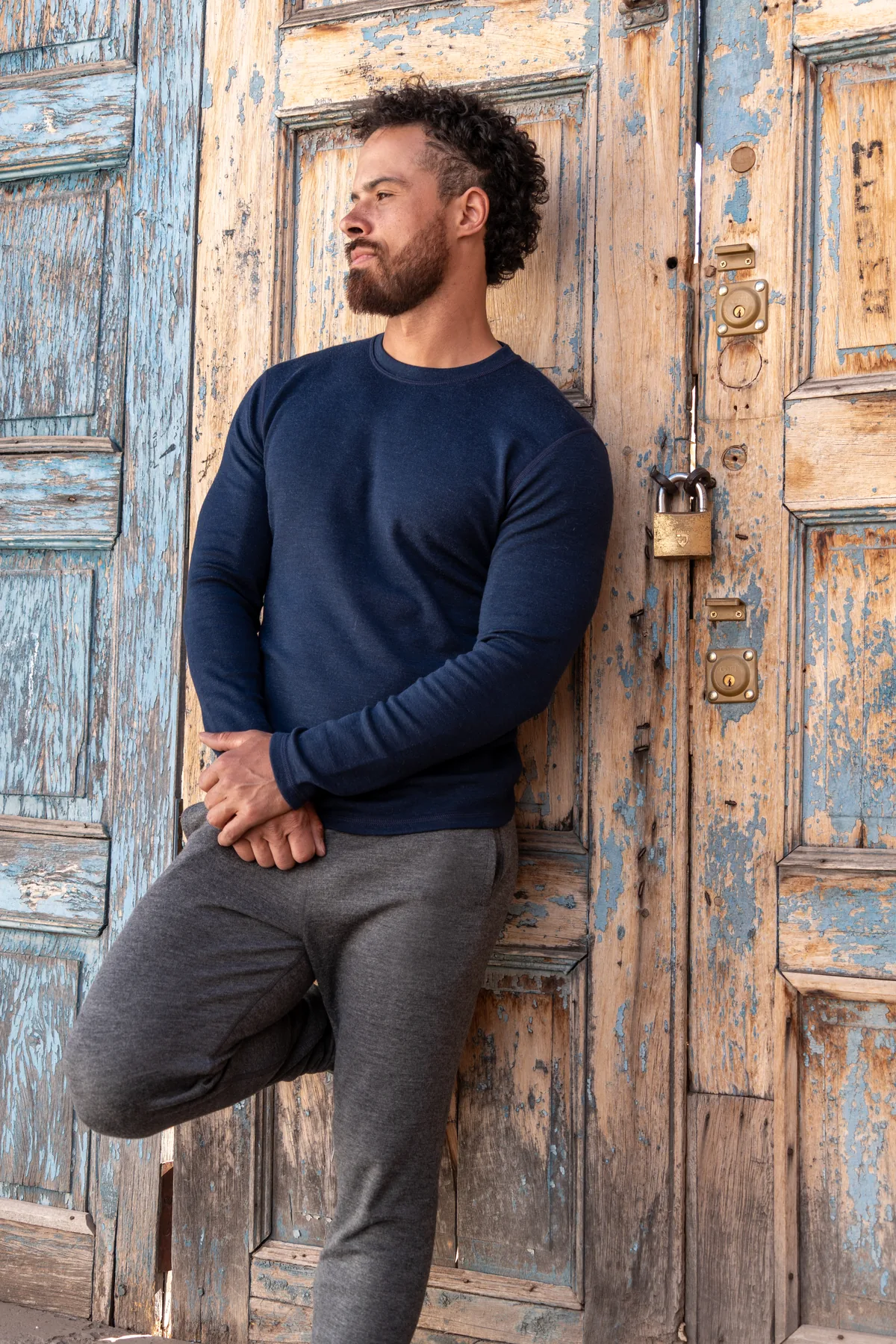 Jono Mitchell portrait beside a blue heritage door