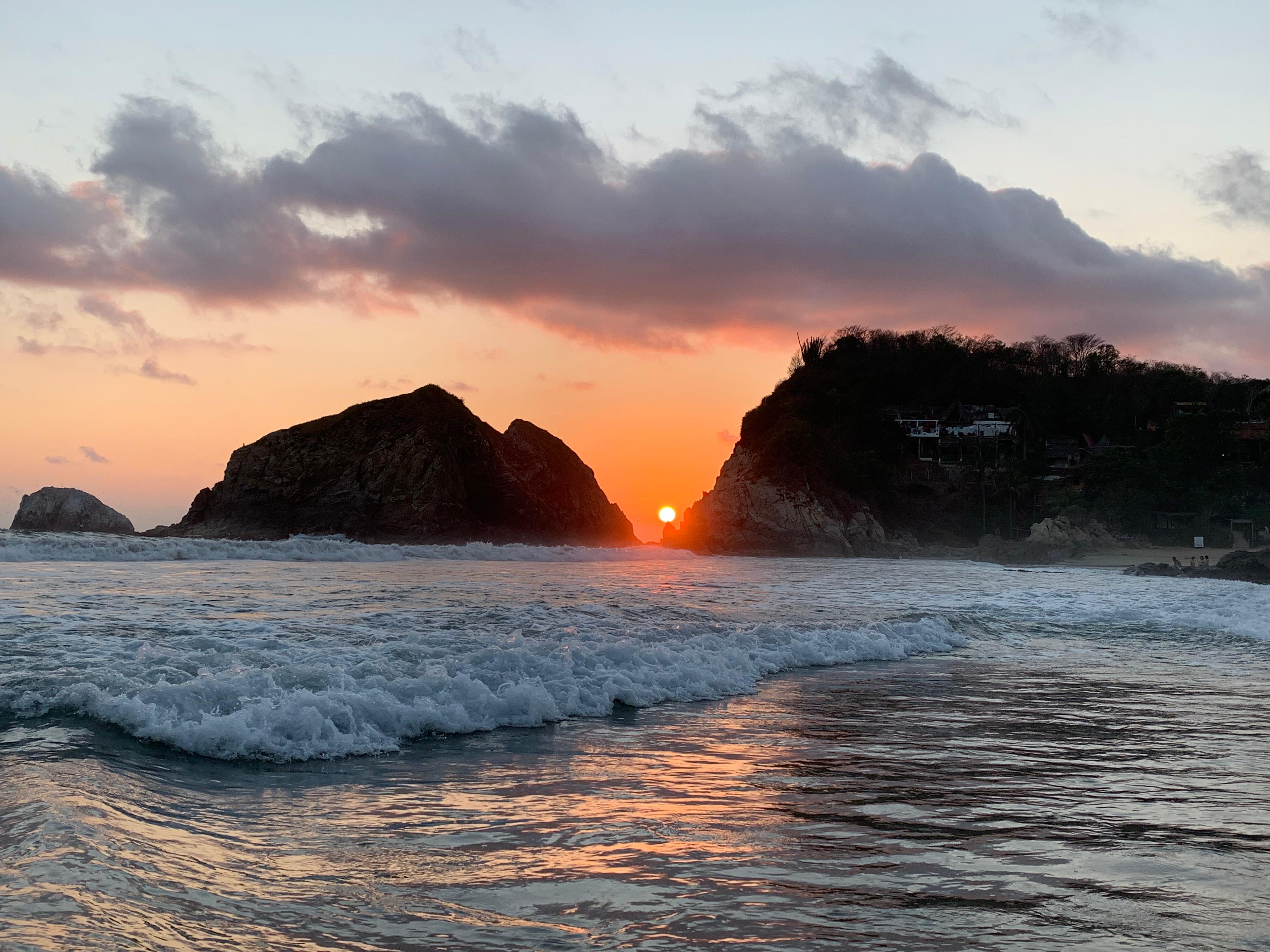 Sunset over the rocky coast in Mazunte, Oaxaca